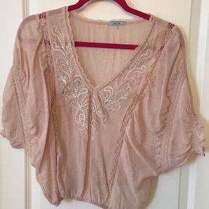 Pink embellished top.